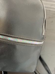 Black Mini Backpack with Pom Po