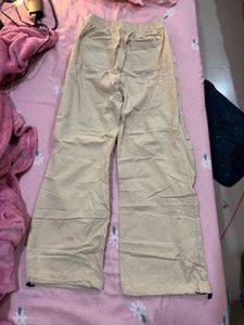 Beige parachute trousers