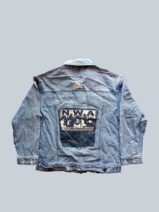 Distressed Blue Denim Jacket With A Touch Of 90s