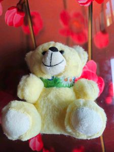 Cute Yellow Teddy Bear with Green Ribbon