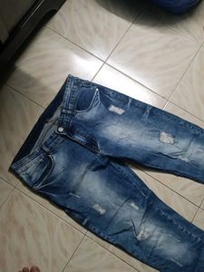 Distressed Blue Denim Jeans