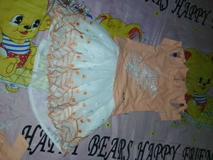 two baby girl dresses are there