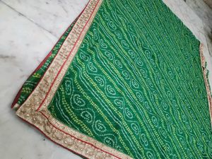 Green bandhni saree with golden border less