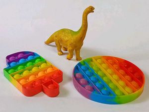 2 Pop It 1 Dinosaur Sligtly Used