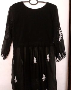 A Short Chikankari Kurti In Black Colour