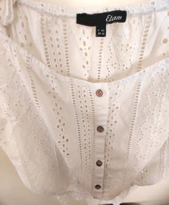 button-up tank top with spaghetti straps.