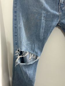Ripped Knee Jeans