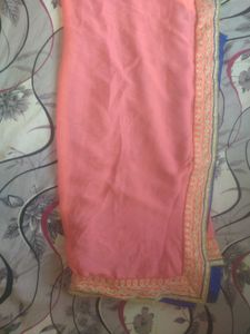 a new coral colour  chiffon saari without blouse