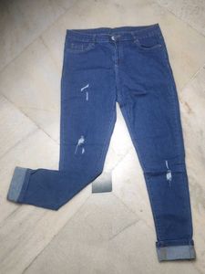 Distressed Blue Denim Jeans