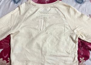 a butter yellow crop top ( full sleeves) it’s from
