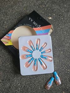 Blue Flame with Nude Nail Extensions