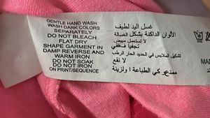 Bright pink sequence embellished cold shoulder top