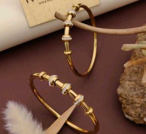 Gold Tone Flower Bangle Set