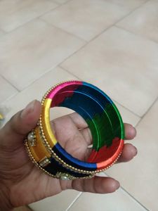 2 Sets Of Multi Colour Thread Bangles