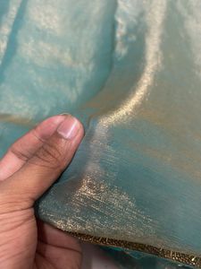 Elegant Teal Saree with Gold Details