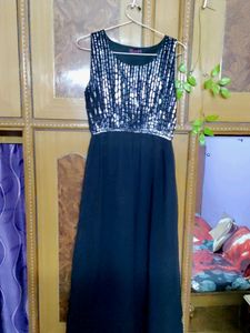 Black slip dress, ankle length.