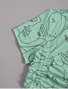 Mint Green Abstract Face Crop Top