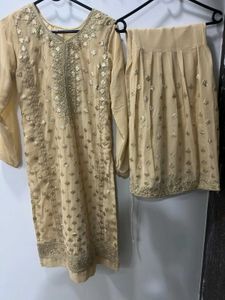 Elegant Cream Embroidered Garara Suit.