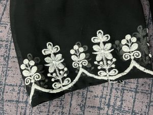 Woman embroidered georgettee A-line Kurta(black)