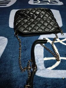 Black Quilted Carrot Sling Bag