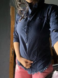 blue shirt that looks fitted on every body type