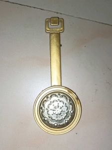 present analog wall clock with glass pendulum