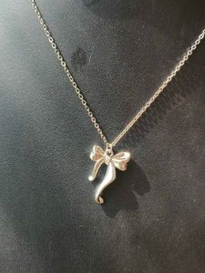 Silver Bow Pendant Necklace