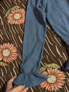 Blue long sleeve knit top