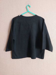 Elegant Black Top with Pearl Detail