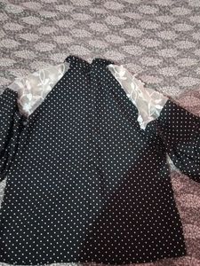 A Black Polyster Top With White Dots Nd Classic .