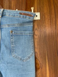 Ripped Knee Light Wash Jeans