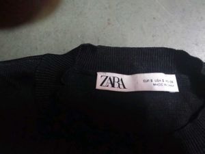 Zara size small black top with cream puffy sleeves