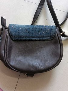 blue and dark brown sling bag