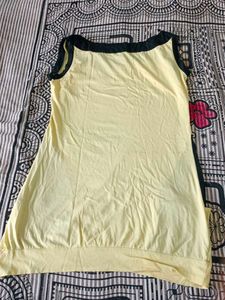Beautiful Seleveless Top In Yellow Black Colour