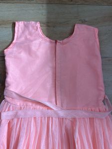 Peach Color Gown In Net For Girls