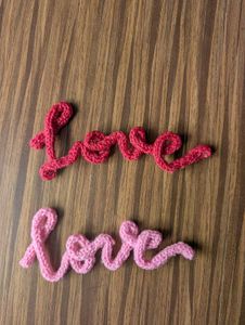 Pink Knitted &#39;Love&#39; Sign