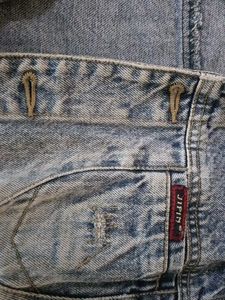 brand new slightly ripped denim jacket