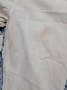 Airways white coloured jeans for waist size 34 a little bit of stain is there u can see in the 2nd photo