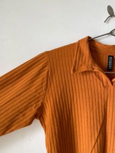 mustard brown top