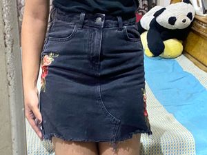 Black embroidered denim skirt