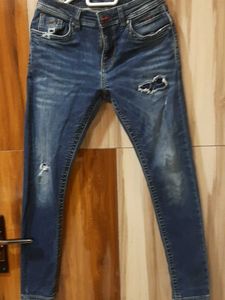 Ripped Blue Denim Jeans