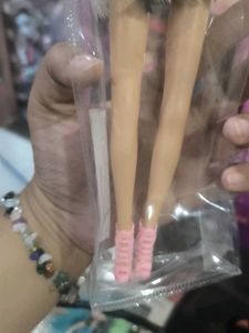 Hannah doll in black dress with long hair.