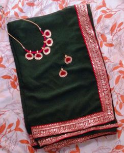 Elegant Green Saree with Pink Border