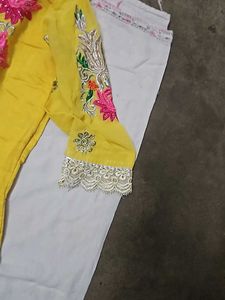 Yellow Kurti With Pink Embroidery