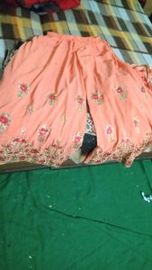 Beautiful green kurti with peach full flaired sharara and dupatta. size M and margin in said too