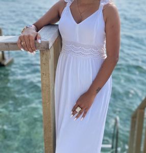 Long White Gown With A Beautiful Back Neck.