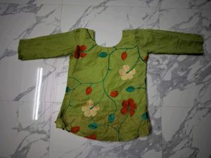 Green Embroidered short kurta top.