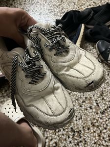very used white sneakers