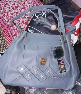 Stylish Blue Handbag with Charm