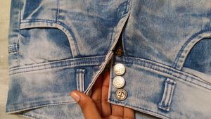 Designer jeans with multiple buttons